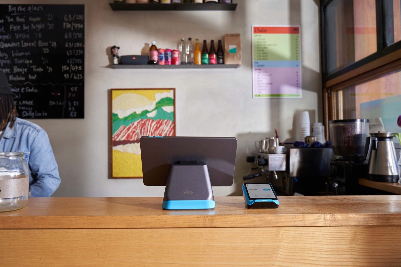 A Yoco point-of-sale counter and card reader in a small cafe